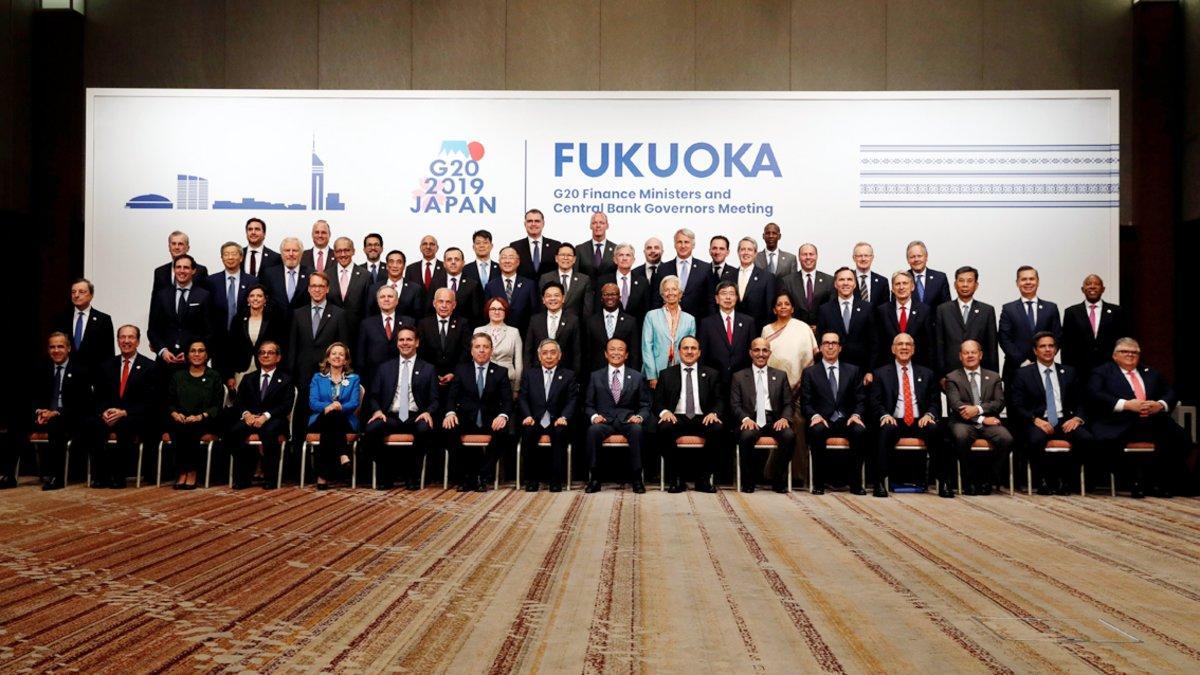 Japan’s Finance Minister Taro Aso poses with delegations members for a family photo during the G20 Finance Ministers and Central Bank Governors Meeting in Fukuoka, Japan June 9, 2019. REUTERS/Kim Kyung-Hoon