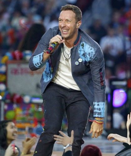 Chris Martin, lead singer of Coldplay, performs during the half-time show at the NFL's Super Bowl 50 between the Carolina Panthers and the Denver Broncos in Santa Clara