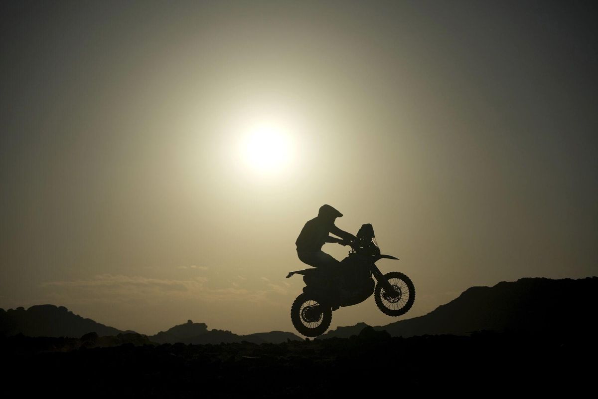 A rider jumps during the sixth stage of the Dakar Rally between Hail and Al Duwadimi, Saudi Arabia, Saturday, Jan. 11, 2025. (AP Photo/Christophe Ena) Associated Press/LaPresse. EDITORIAL USE ONLY/ONLY ITALY AND SPAIN