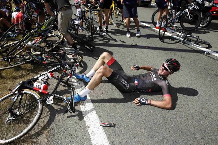 Bora-Argon 18 rider Dominik Nerz of Germany lies on the ground after a fall during the third stage of the 102nd Tour de France cycling race from Anvers to Huy