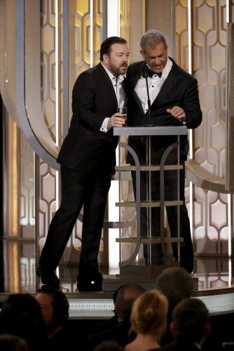 Handout photo of host Ricky Gervais standing with presenter Mel Gibson at the 73rd Golden Globe Awards in Beverly Hills