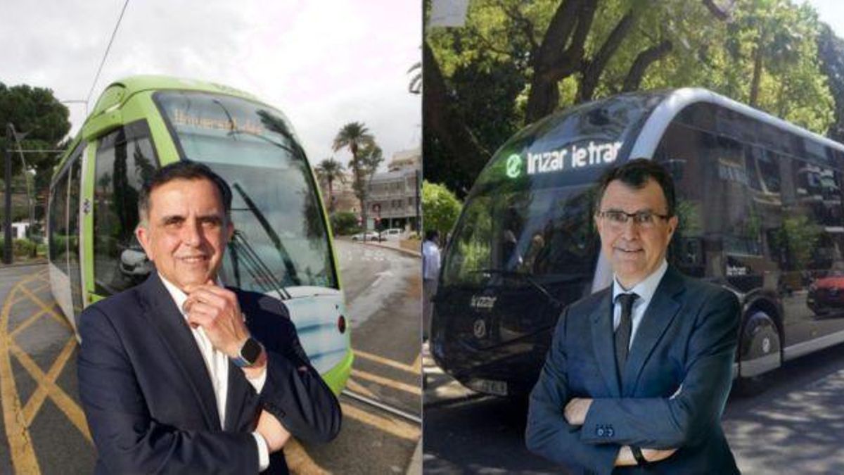 José Antonio Serrano y José Ballesta frente al tranvía y el tranvibús.