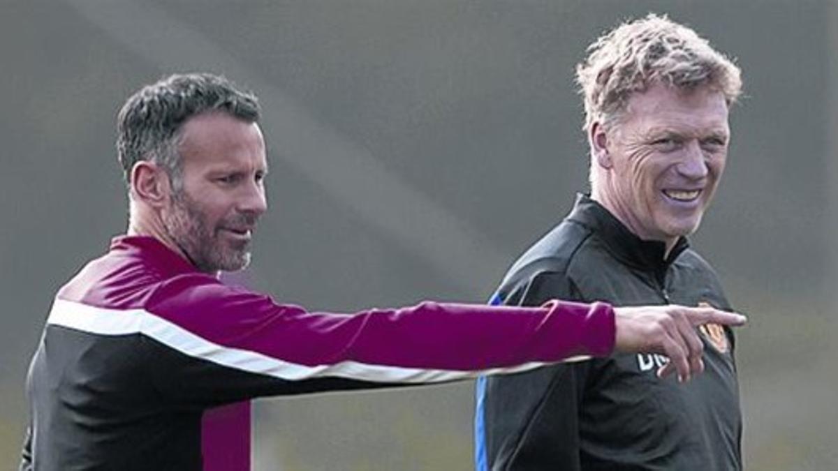 Ryan Giggs y David Moyes, derecha, en un entrenamiento.