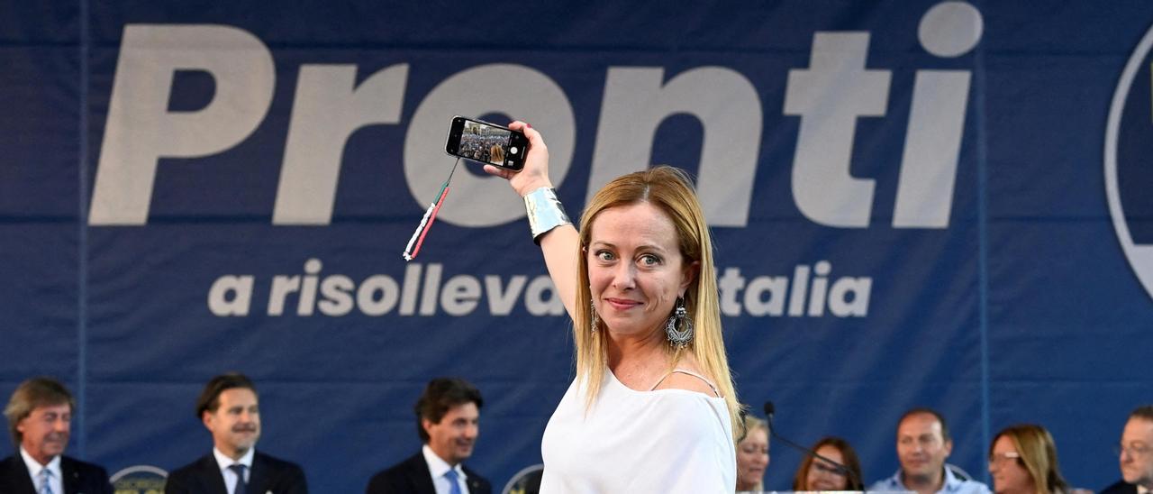 FILE PHOTO: Giorgia Meloni, leader of the far-right Brothers of Italy party, attends a rally in Milan