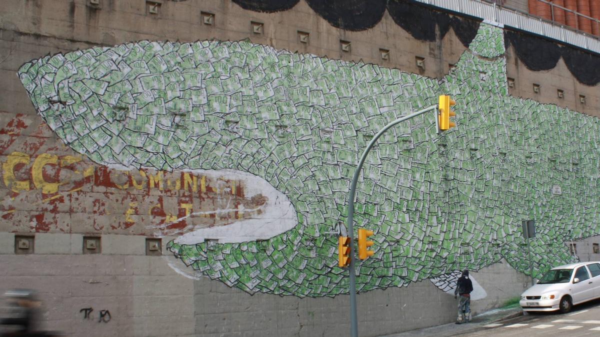 Borrado el grafiti del Tiburón capitalista del artista italiano anónimo Blu que adornaba un muro del barrio de El Carmel desde febrero de 2009.