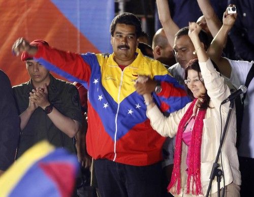 Venezuelan presidential candidate Maduro and wife celebrate after the official results gave him a victory in Caracas