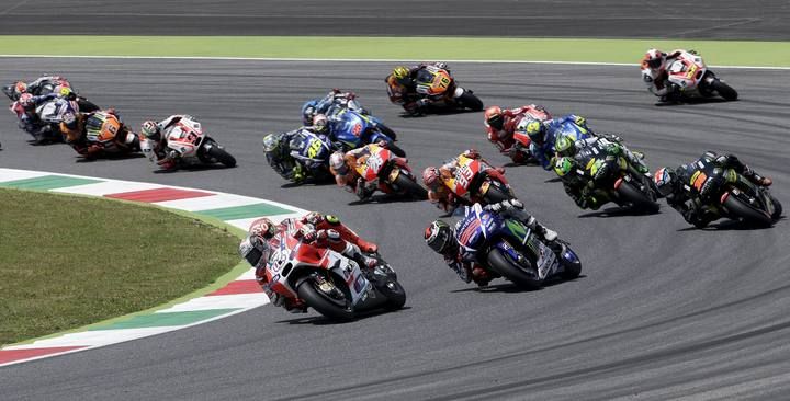 Ducati MotoGP rider Dovizioso of Italy leads the pack during the first lap of the Italian Grand Prix at the Mugello circuit