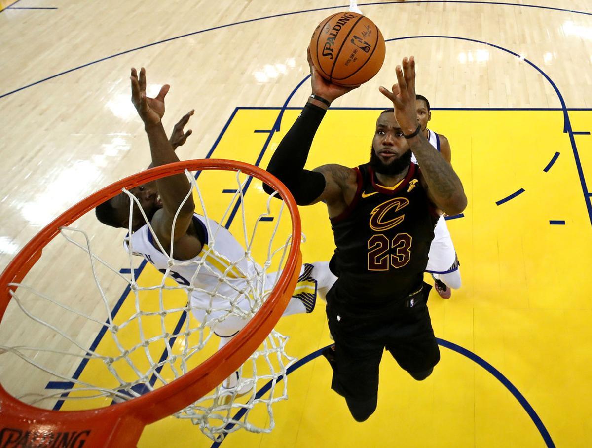 May 31, 2018; Oakland, CA, USA; Cleveland Cavaliers forward LeBron James (23) shoots the ball against Golden State Warriors forward Draymond Green (23) in game one of the 2018 NBA Finals at Oracle Arena. Mandatory Credit: Ezra Shaw/pool photo via USA TODAY Sports