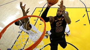 May 31, 2018; Oakland, CA, USA; Cleveland Cavaliers forward LeBron James (23) shoots the ball against Golden State Warriors forward Draymond Green (23) in game one of the 2018 NBA Finals at Oracle Arena. Mandatory Credit: Ezra Shaw/pool photo via USA TODAY Sports