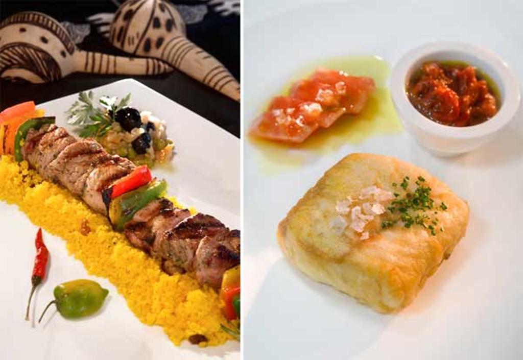 Brocheta de cordero en el restaurante Blanco y Negro y merluza, plato estrella de El Valles.