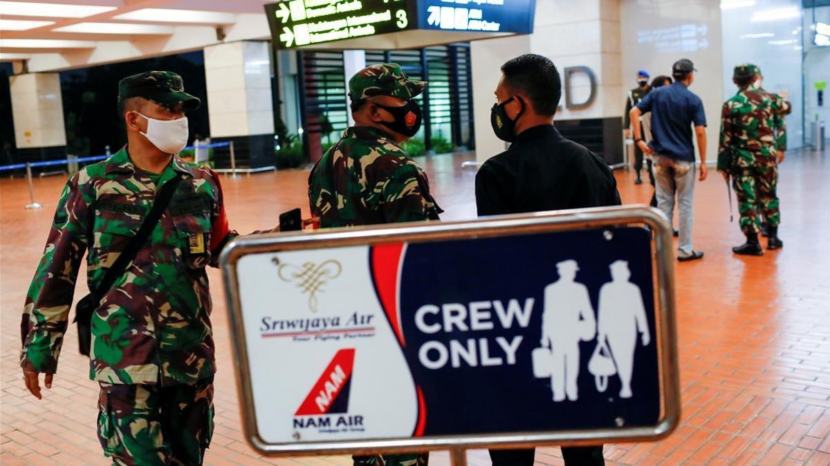 Indonesian soldiers are seen at Soekarno-Hatta International Airport after Sriwijaya Air plane flight SJ182 with more than 50 people on board lost contact after taking off  according to local media  in Tangerang  near Jakarta  Indonesia  January 9  2021  REUTERS Willy Kurniawan