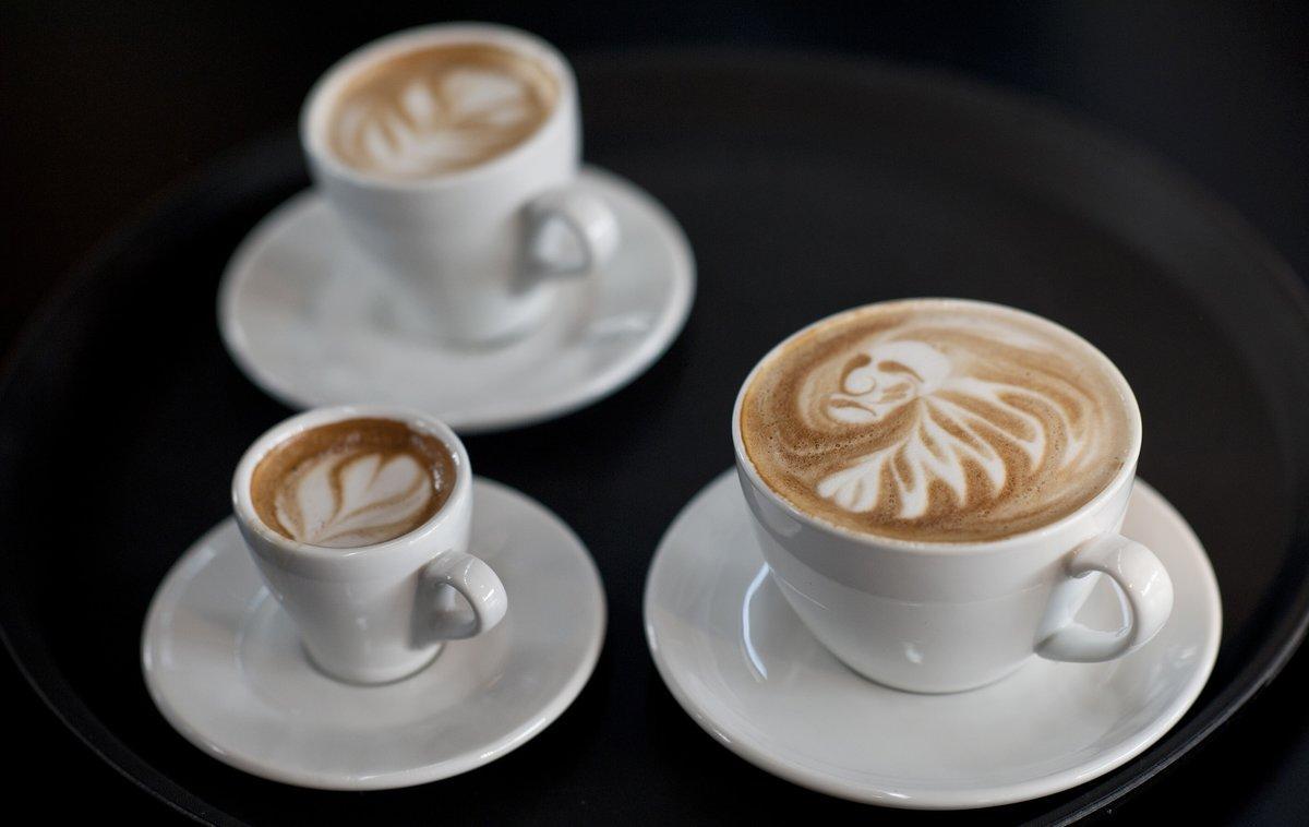 Latte art is displayed during the finals of the German Barista Championships in Hamburg April 17, 2011. During the coffee competition participants are required to serve each of the four sensory judges a single espresso, a single cappuccino and a single signature beverage of his or her choice (espresso-based and alcohol-free) for a total of 12 drinks, while also being judged by one head judge and two technical judges during a period of 15 minutes or less.  REUTERS/Morris Mac Matzen (GERMANY - Tags: SOCIETY)