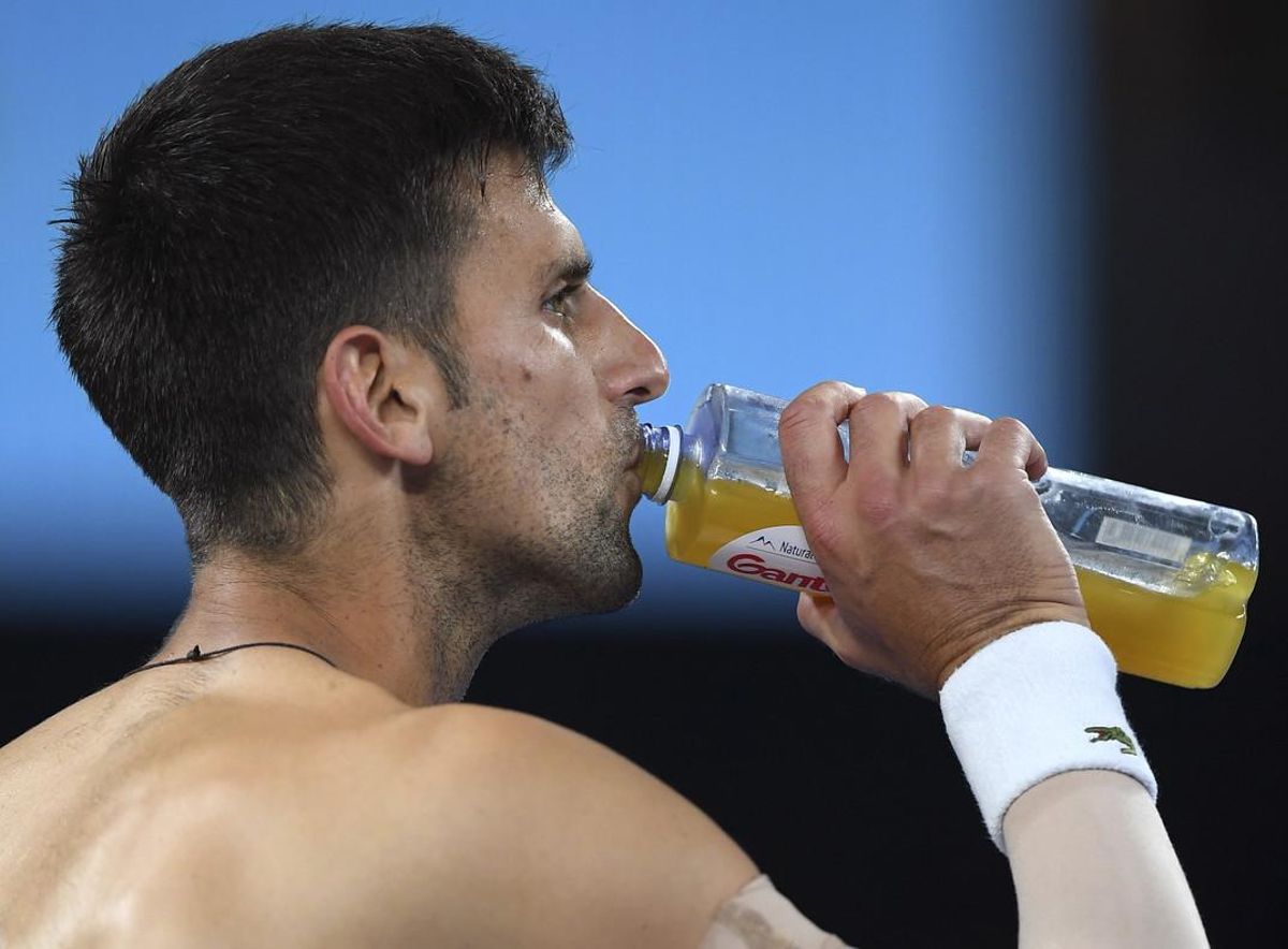 Serbia’s Novak Djokovic takes a drink during a break in his fourth round match against South Korea’s Chung Hyeon at the Australian Open tennis championships in Melbourne, Australia, Monday, Jan. 22, 2018. (AP Photo/Andy Brownbill)