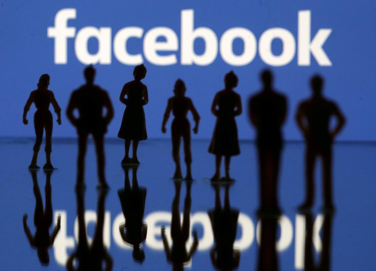 FILE PHOTO  Small toy figures are seen in front of Facebook logo in this illustration picture  April 8  2019  REUTERS Dado Ruvic  File Photo