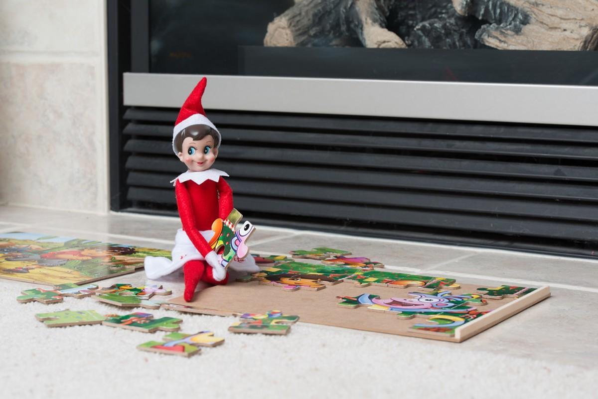 An elf doing a puzzle