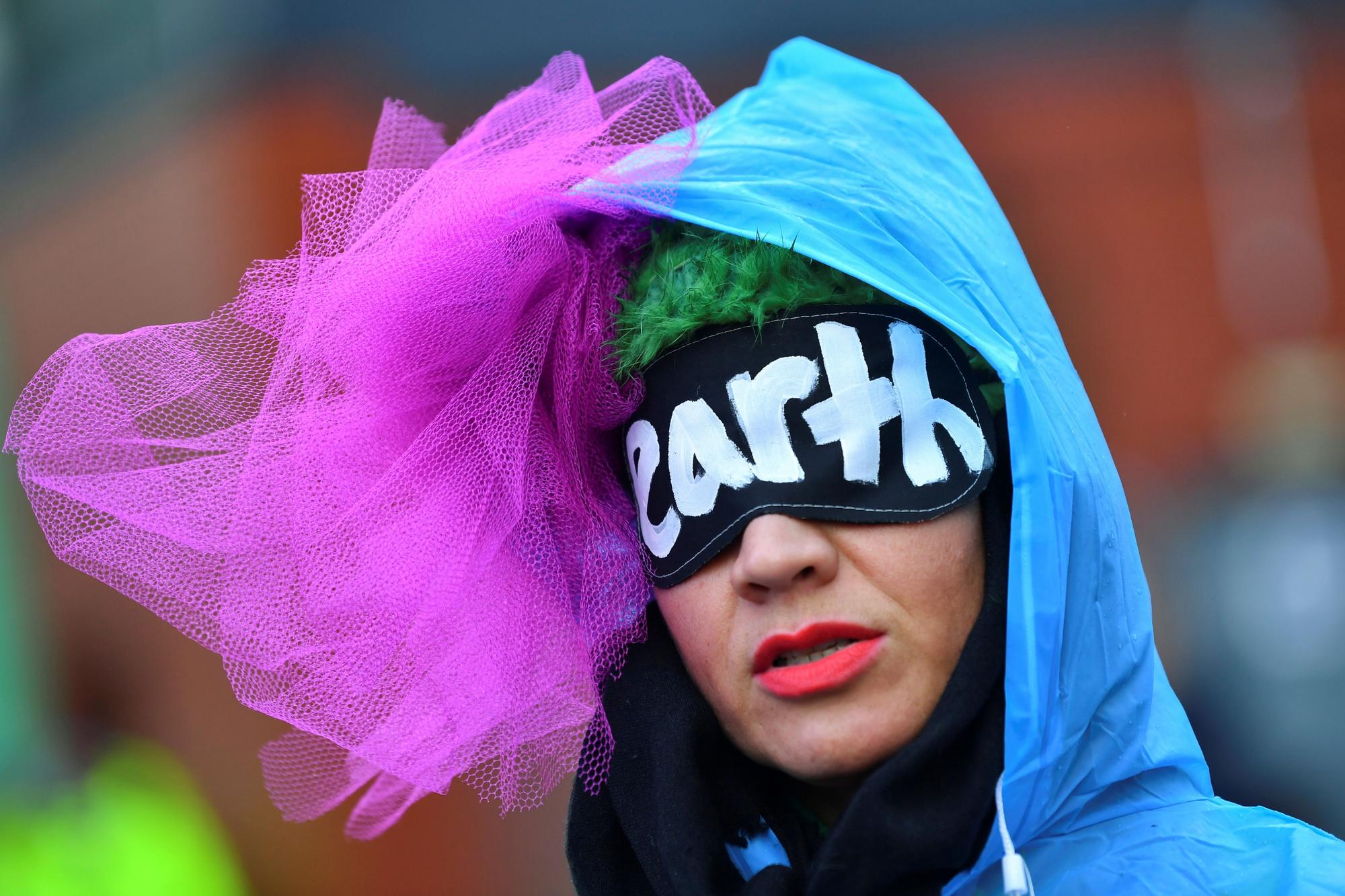 A person demonstrates near the UN Climate Change Conference (COP26) venue, in Glasgow, Scotland, Britain November 12, 2021. REUTERS/Dylan Martinez TPX IMAGES OF THE DAY