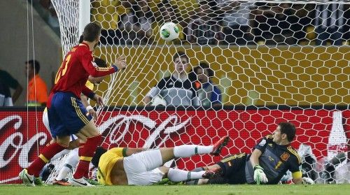 Brazil's Fred kicks to score a goal past Spain's goalkeeper Casillas during their Confederations Cup final soccer match at the Estadio Maracana in Rio de Janeiro