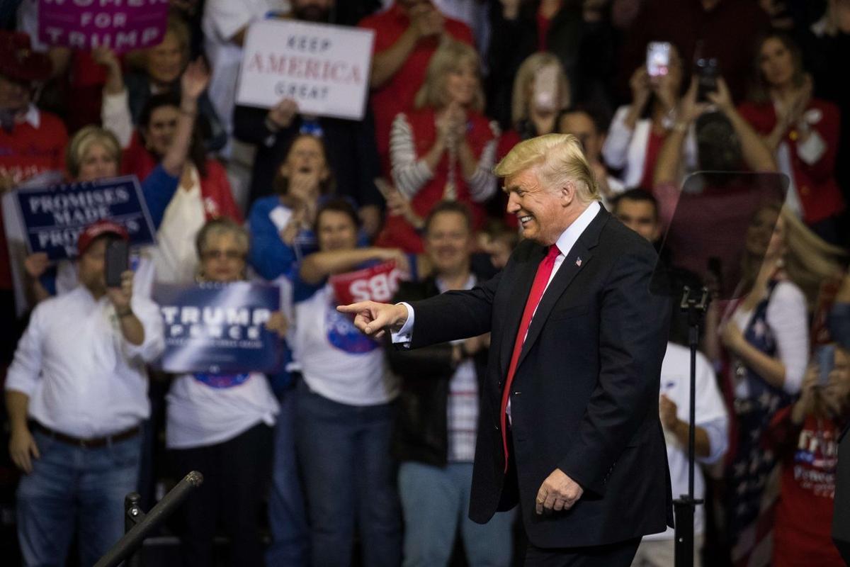 HOUSTON, TX - OCTOBER 22: U.S. President Donald Trump takes the stage for a rally in support of Sen. Ted Cruz (R-TX) on October 22, 2018 at the Toyota Center in Houston, Texas. Cruz, the incumbent, is seeking Senate re-election in a high-profile race against Democratic challenger Beto O’Rourke.   Loren Elliott/Getty Images/AFP