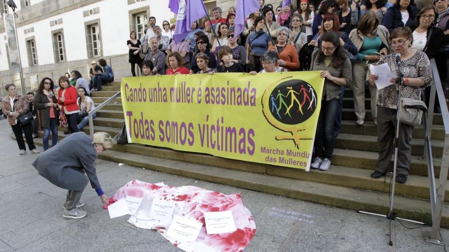 Participantes en una protesta contra la violencia machista.