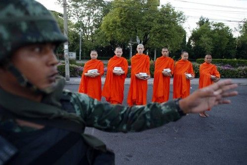 Thai soldier stands guard outside a temple near Government House in Bangkok