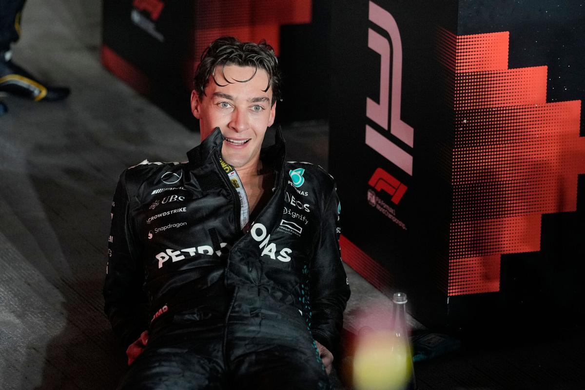 Mercedes driver George Russell of Britain celebrates after winning the Singapore Formula One Grand Prix at the Marina Bay Street Circuit in Singapore, Sunday, Oct. 5, 2025. (AP Photo/Vincent Thian)