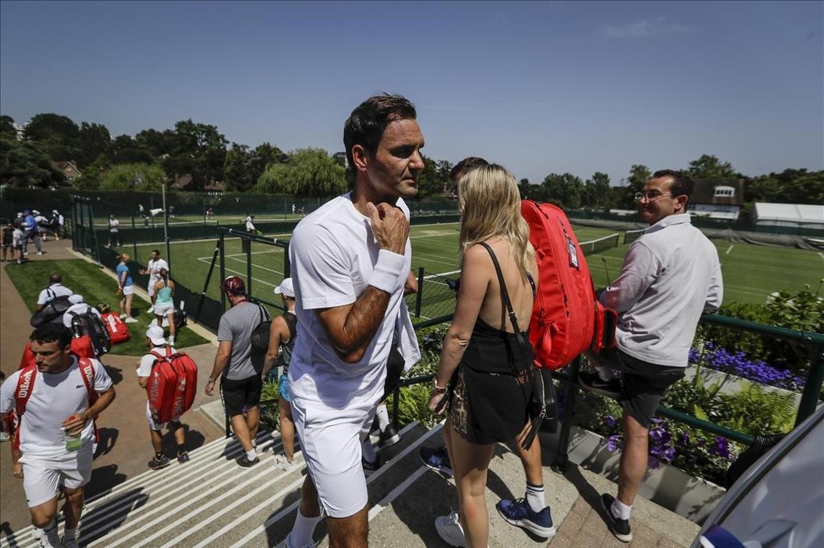 lmendiola48855742 switzerland s roger federer walks back after a practice sess190629193703