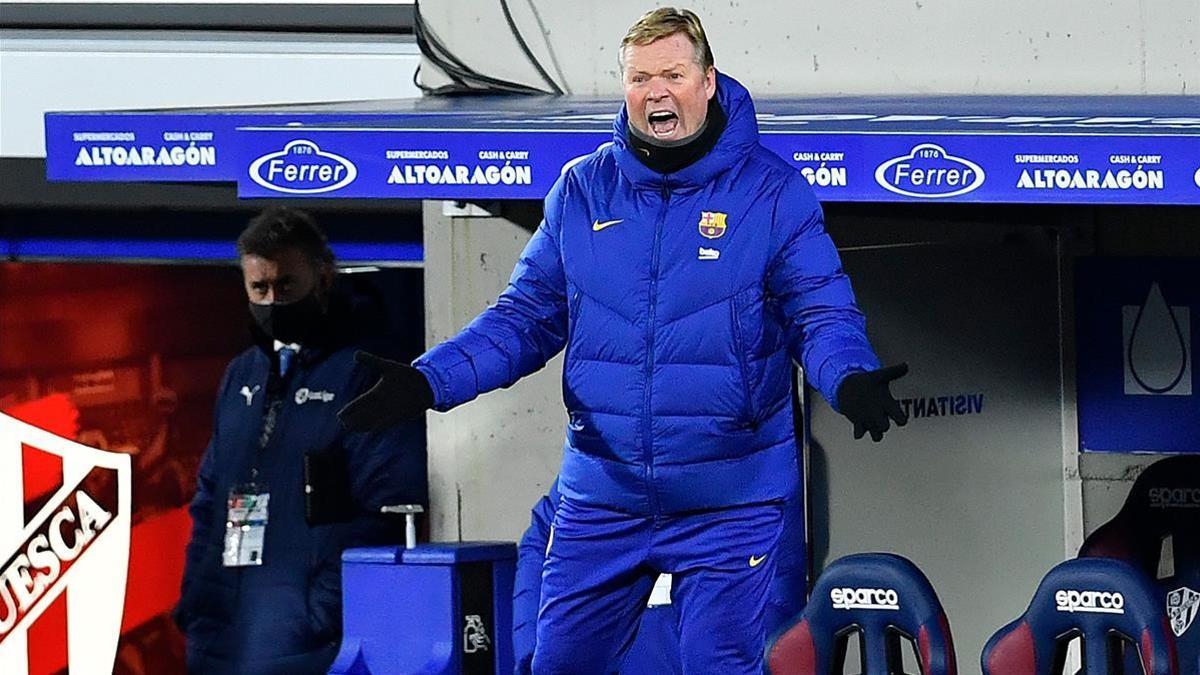 Barcelona s Dutch coach Ronald Koeman reacts during the Spanish League football match between Huesca and Barcelona at the El Alcoraz stadium in Huesca on January 3  2021  (Photo by Pau BARRENA   AFP)