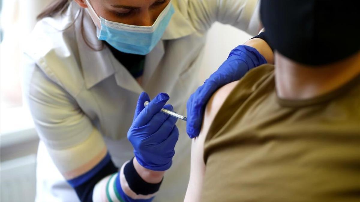 Latvian Army serviceman receives the Pfizer-BioNTech vaccine against the coronavirus disease (COVID-19) in Adazi  Latvia May 7  2021 REUTERS Ints Kalnins