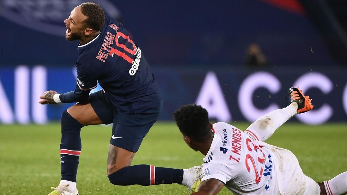 CORRECTION - Paris Saint-Germain s Brazilian forward Neymar (L) is tackled by Lyon s Brazilian midfielder Tiago Mendes during the French L1 football match between Paris Saint-Germain (PSG) and Lyon (OL)  on December 13  2020 at the Parc des Princes stadium in Paris  (Photo by FRANCK FIFE   AFP)    The erroneous mention appearing in the metadata of this photo by FRANCK FIFE has been modified in AFP systems in the following manner  Lyon s Brazilian midfielder Tiago Mendes instead of Lyon s Dutch defender Kenny Tete  Please immediately remove the erroneous mention from all your online services and delete it from your servers  If you have been authorized by AFP to distribute it to third parties  please ensure that the same actions are carried out by them  Failure to promptly comply with these instructions will entail liability on your part for any continued or post notification usage  Therefore we thank you very much for all your attention and prompt action  We are sorry for the inconvenience this notification may cause and remain at your disposal for any further information you may require