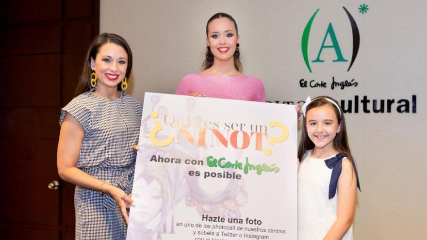 Las Belleas del Foc con el cartel del concurso