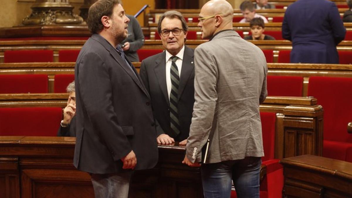 Oriol Junqueras, Artur Mas y Raül Romeva, en el Parlament.