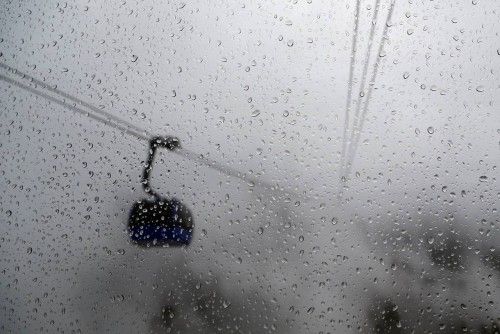 Raindrops are seen on a gondola's window on a foggy day near the Rosa Khutor alpine resort close to Sochi