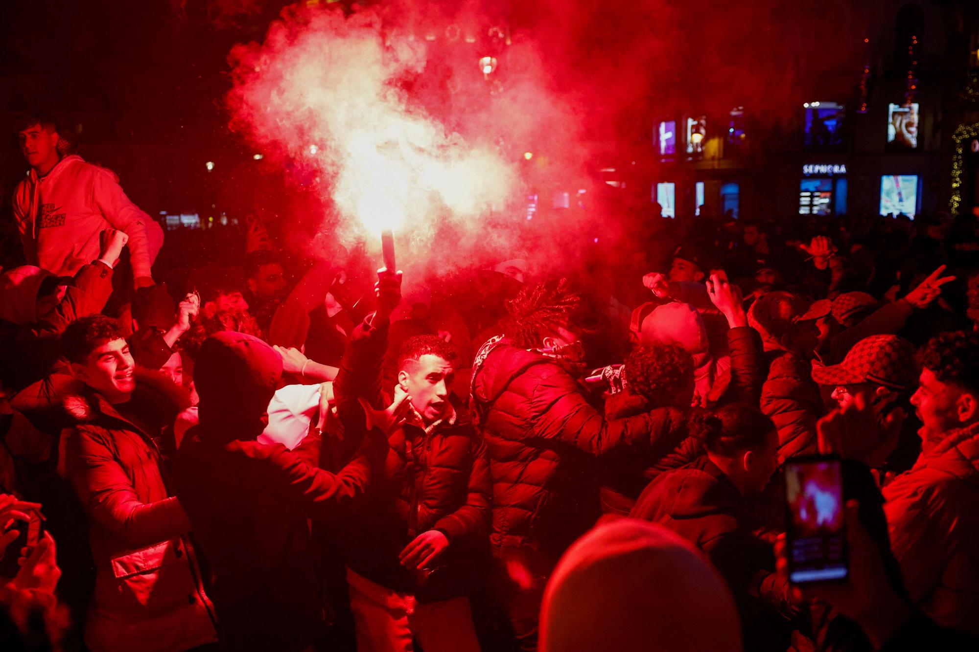 Morocco fans react as they gather in Sol square after the FIFA World Cup Qatar 2022 match between Spain and Morocco, in Madrid