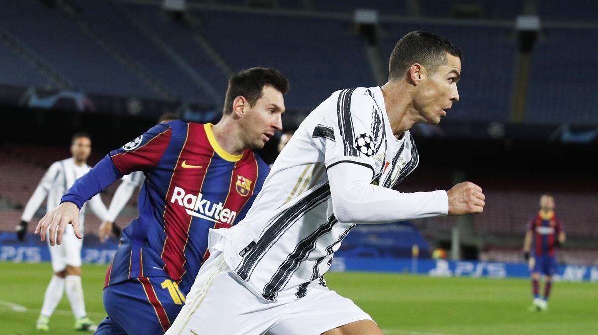 Soccer Football - Champions League - Group G - FC Barcelona v Juventus - Camp Nou  Barcelona  Spain - December 8  2020 FC Barcelona s Lionel Messi in action with Juventus  Cristiano Ronaldo REUTERS Albert Gea