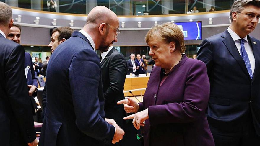 President del Consell Europeu amb la cancellera alemanya.