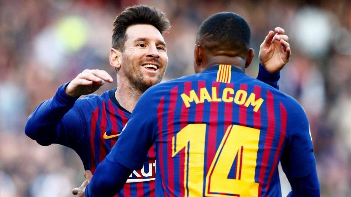 Malcom y Messi celebrando un gol ante el Espanyol en LaLiga