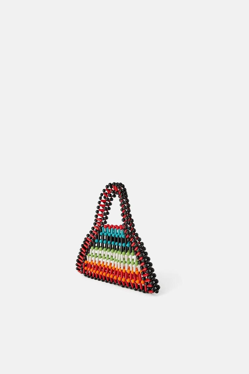Mini bolso shopper de bolitas multicolor de Zara. (Precio: 19, 95 euros)