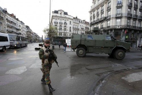 Belgian soldiers patrol in central Brussels, after security was tightened in Belgium following the fatal attacks in Paris