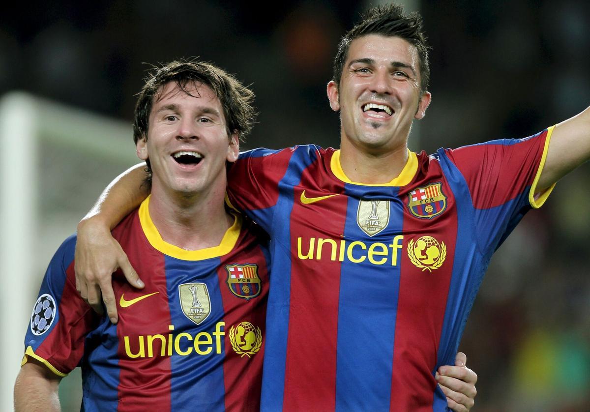 Leo Messi y David Villa durante un partido del Barça, en 2010.