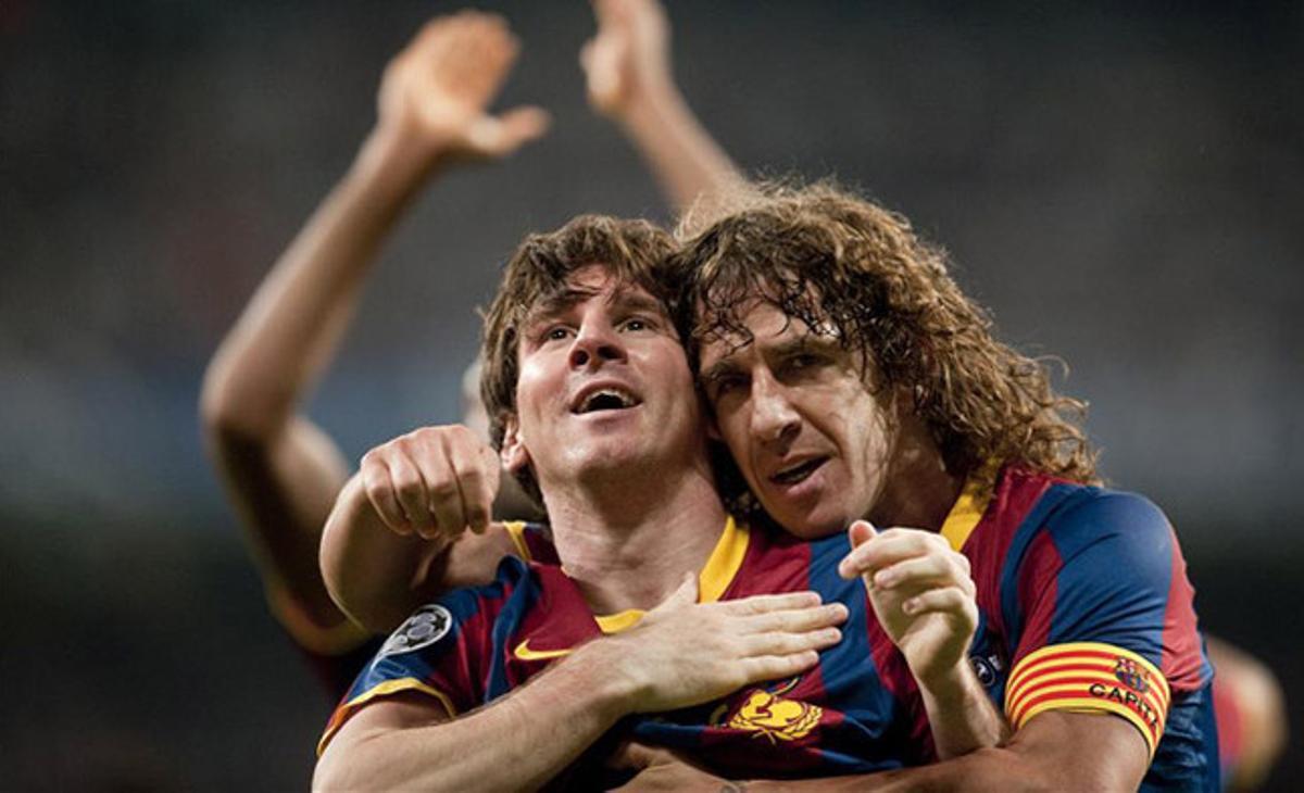 El abrazo del capitán. Puyol felicita a Messi después de que el argentino marcara el 0-1 del conjunto azulgrana en la ida de las semifinales de la Champions contra el Real Madrid.