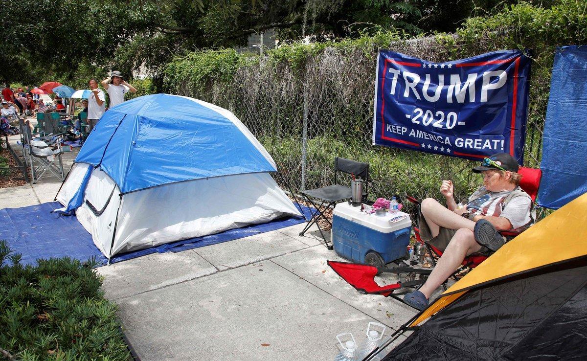 Supporters of US President Donald Trump wait along one of the main streets outside the Amway Center on June 17  2019 some 40 hours before a Trump campaign event in Orlando  Florida  - President Trump is expected to launch his 2020 re-election campaign here on Tuesday night   Photo by Gregg Newton   AFP