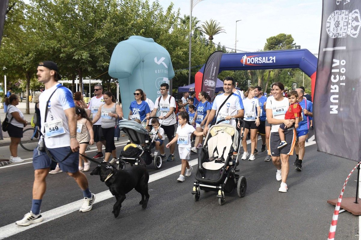La carrera y marcha Solidaria Asteamur, en imágenes