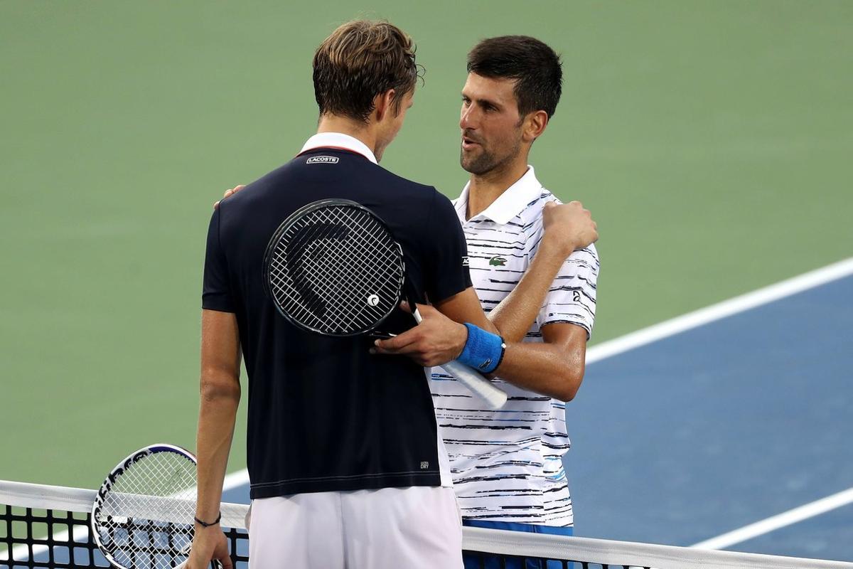 MASON, OHIO - AUGUST 17: Daniil Medvedev of Russia (L) shakes hands with Novak Djokovic of Serbia after defeating him in three sets during Day 8 of the Western and Southern Open at Lindner Family Tennis Center on August 17, 2019 in Mason, Ohio.   Rob Carr/Getty Images/AFP