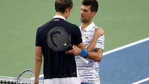 MASON, OHIO - AUGUST 17: Daniil Medvedev of Russia (L) shakes hands with Novak Djokovic of Serbia after defeating him in three sets during Day 8 of the Western and Southern Open at Lindner Family Tennis Center on August 17, 2019 in Mason, Ohio.   Rob Carr/Getty Images/AFP