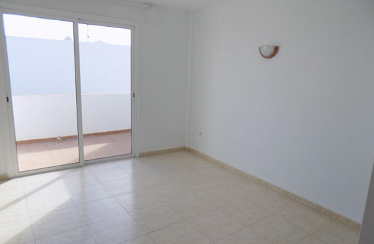 Uno de los dormitorios del inmueble