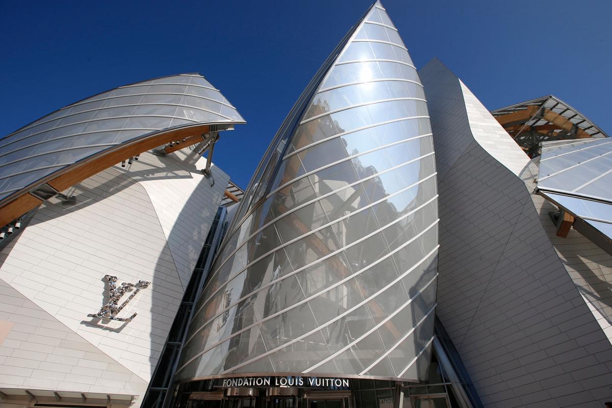 FILE - The Louis Vuitton Foundation building designed by American architect Frank Gehry is pictured before the presentation of Louis Vuittons Spring/Summer 2015 ready-to-wear fashion collection in Paris, Wednesday, Oct. 1, 2014.  (AP Photo/Francois Mori, File). FILE PHOTO
