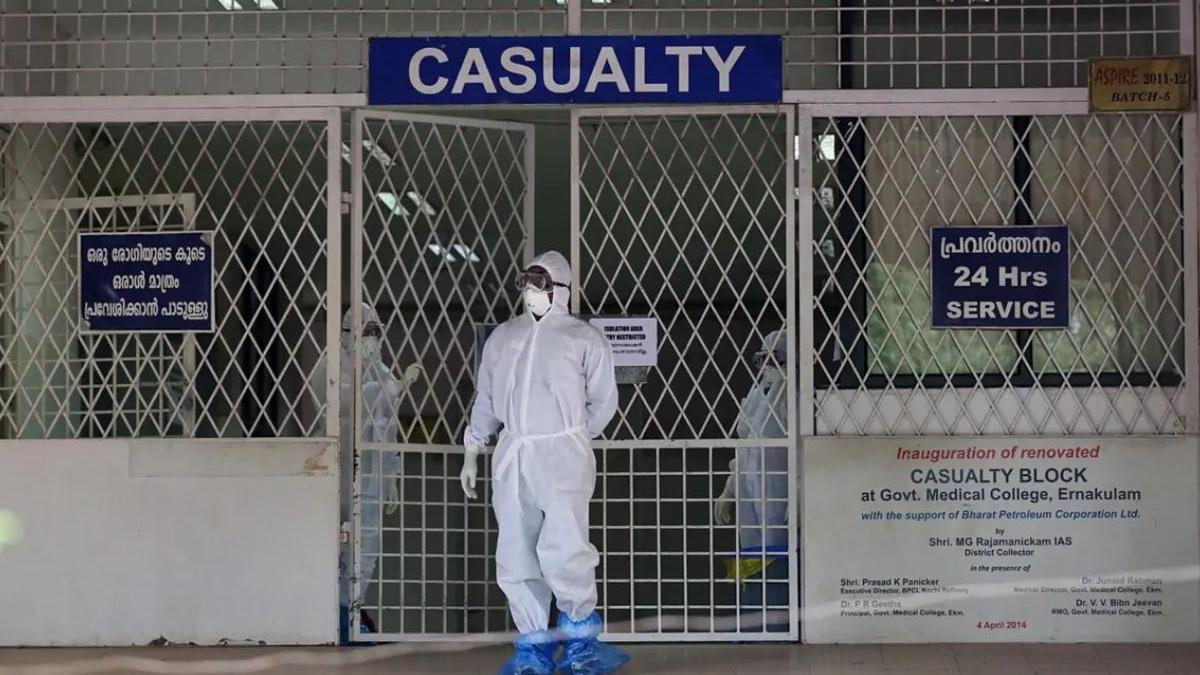 A Medical personnel wearing protective clothing comes out of a quarantined hospital in Kochi, Kerala, India during a Nipah outbreak on 6 August 2019