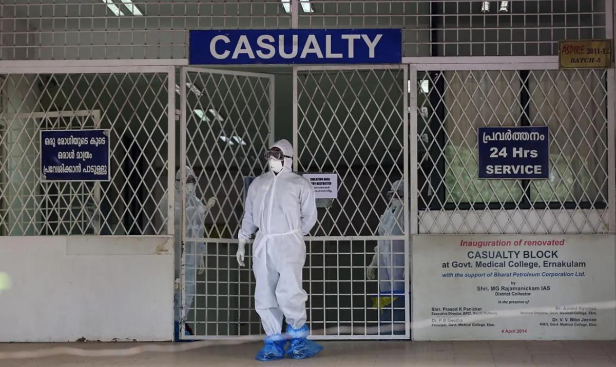 A Medical personnel wearing protective clothing comes out of a quarantined hospital in Kochi, Kerala, India during a Nipah outbreak on 6 August 2019