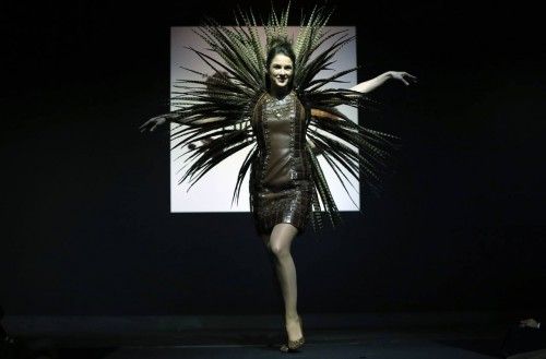 A model dressed in an outfit made with chocolate presents a creation at the Brussels Chocolate Festival
