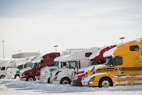 Trucks are parked in a lot off the Route 90 section of the New York State Thruway in the town of Cheektowaga near Buffalo, New York